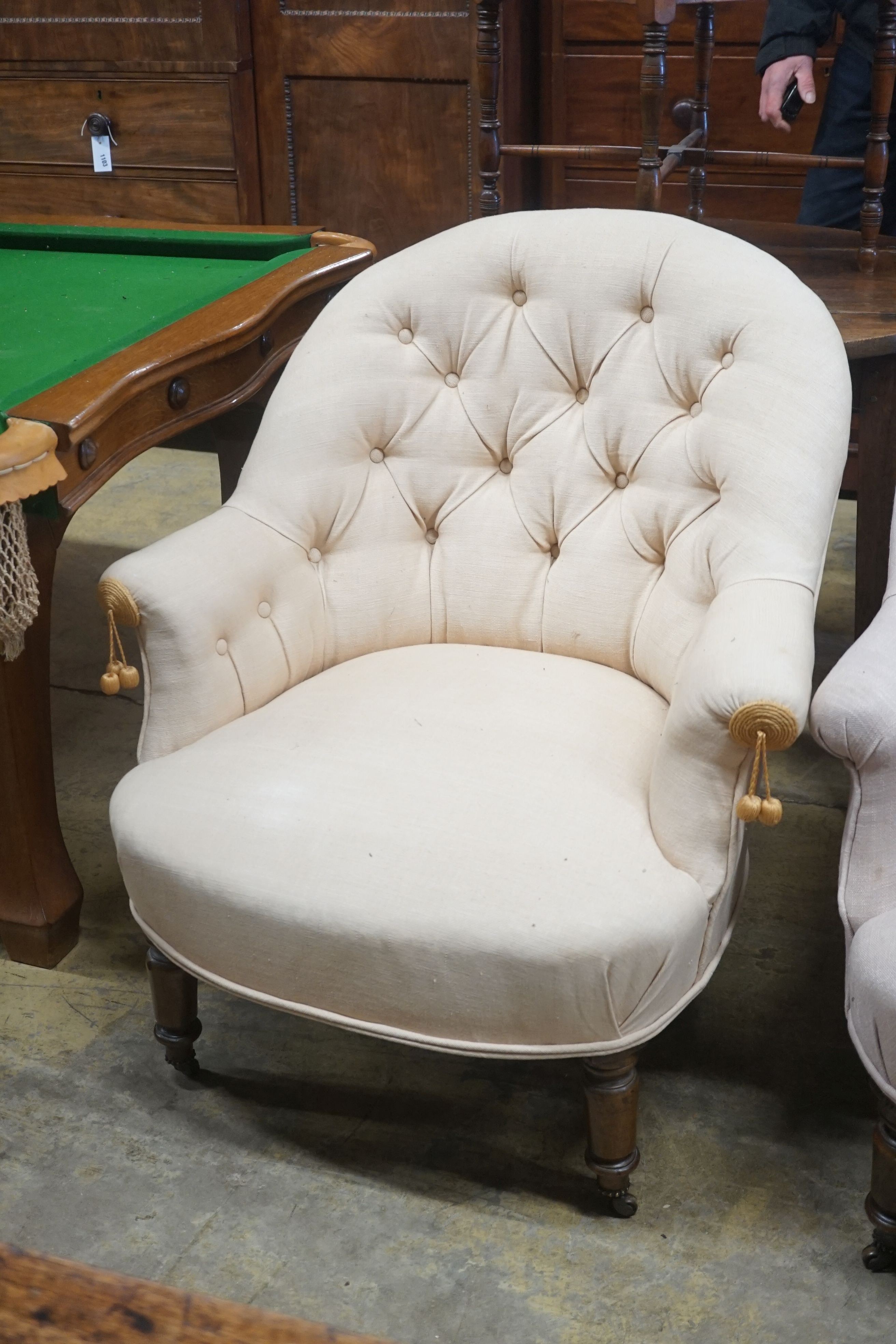 A pair of Victorian upholstered button back tub framed chairs